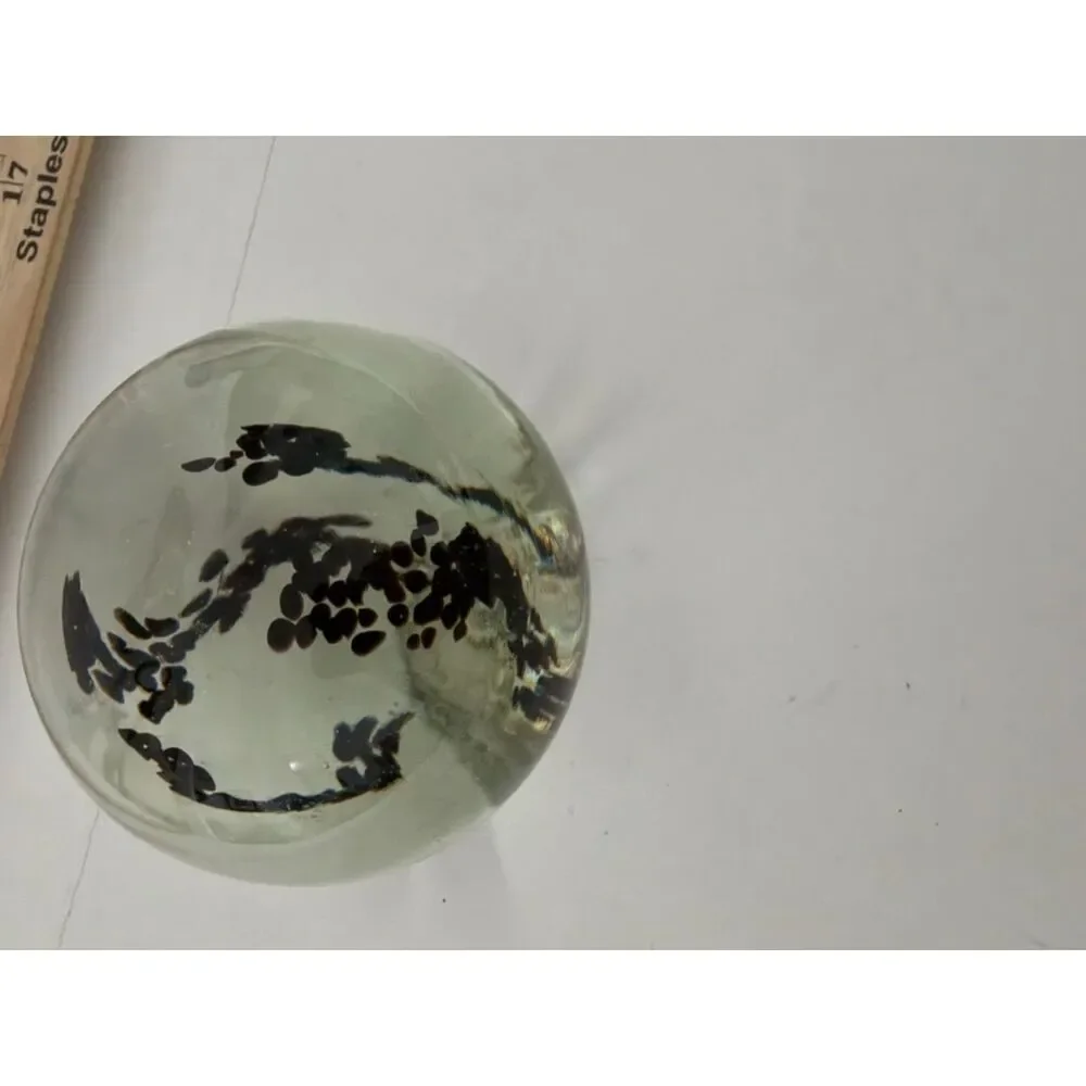 Vintage art glass paperweight with black Inclusions